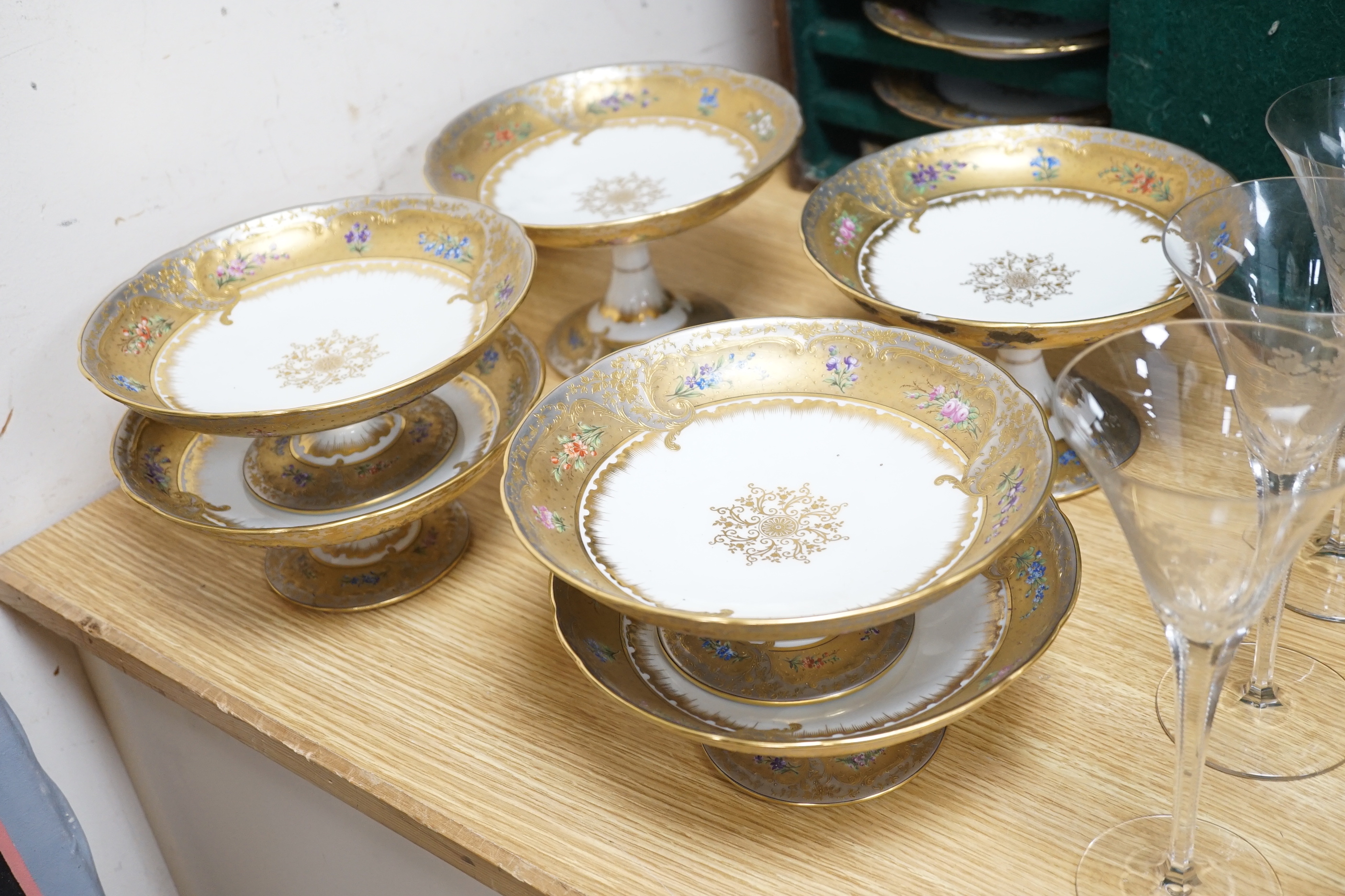 A late 19th Ernst Wahliss Vienna eighteen piece porcelain floral dessert service and a plate carrier, largest pieces 22cm in diameter